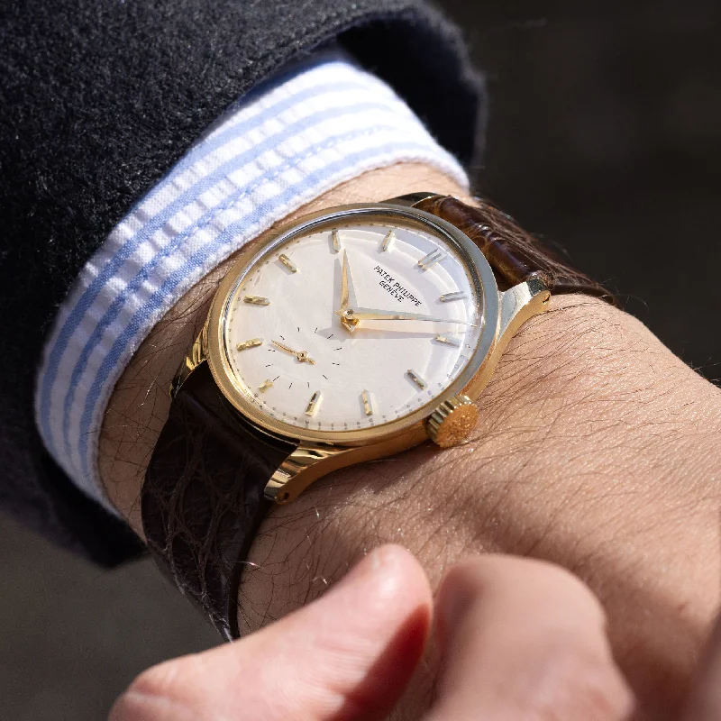 Men's Patek Philippe Watches with Advanced Materials-Patek Philippe Calatrava in 18k Yellow Gold Ref. 570J Silver Dial with Extract of the Archives
