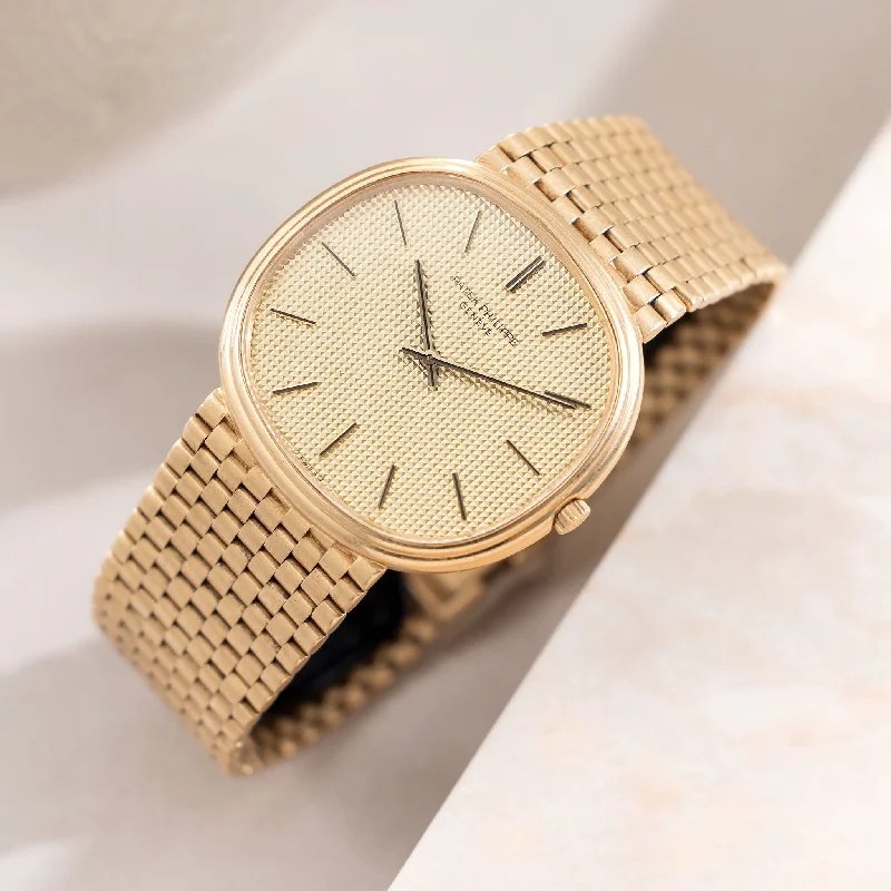 Men's Patek Philippe Watches for Navigation Instruments-Patek Ellipse Golden Ellipse Hobnail Dial "Jumbo TV case" in 18K Yellow Gold and Rare Integrated Brick Bracelet Ref. 3739/2