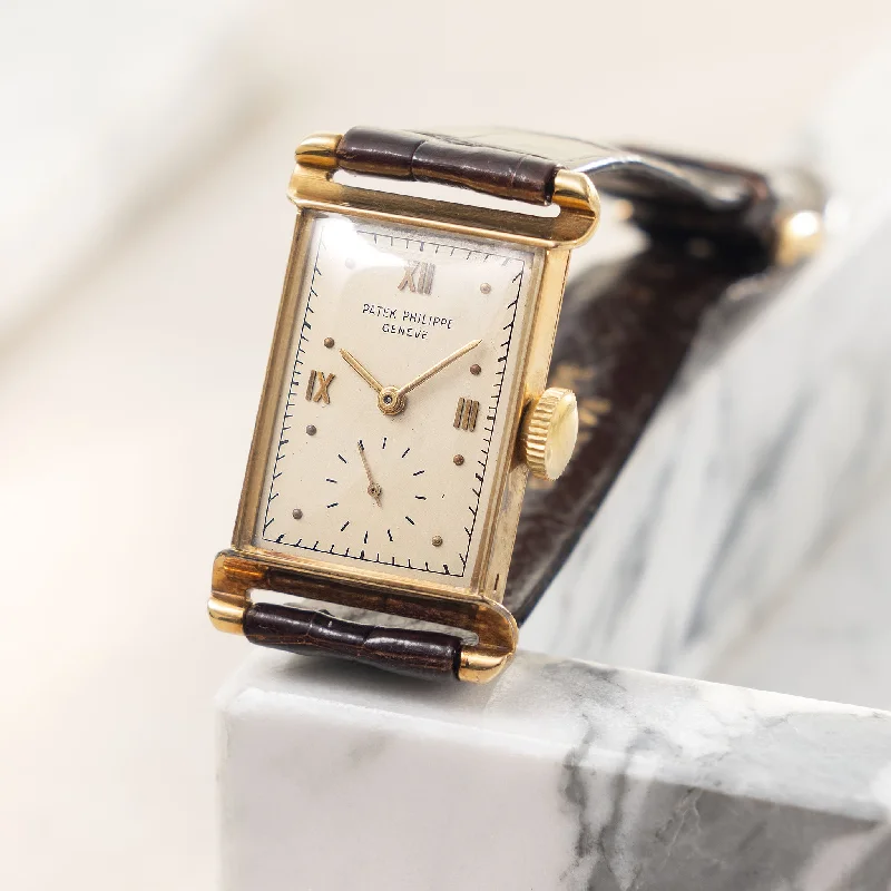 Men's Patek Philippe Watches for Travelers-Patek Philippe rectangular 18 k yellow gold dress watch ref 1580