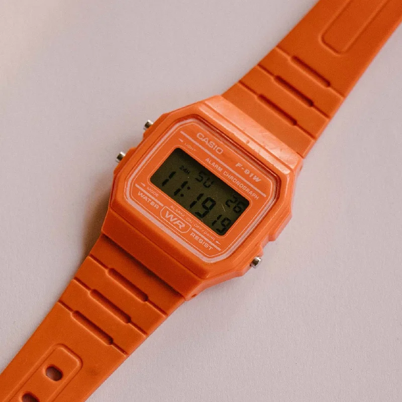 Women's Pilot Watches for Travelers-Orange Casio F-91W Alarm Chronograph WR Quartz Watch